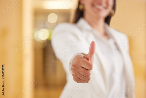 Do your best and success will follow. Closeup shot of an unrecognisable businesswoman showing thumbs up in an offce.