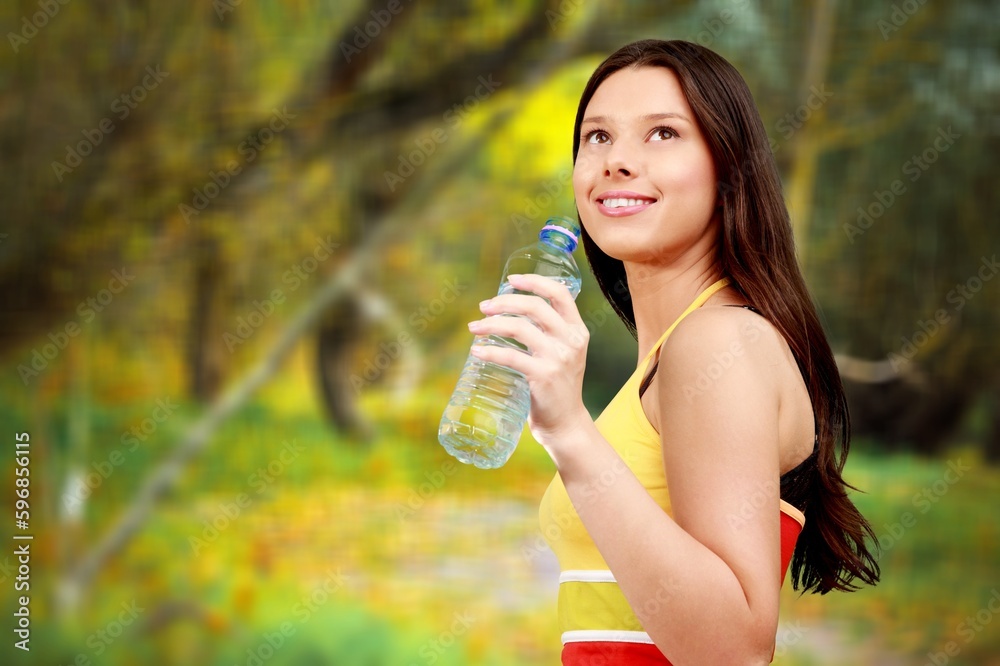Calm fitness woman on beautiful nature background Calm fitness woman on beautiful nature background