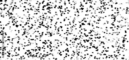 Small uneven spots and particles of debris. Abstract vector texture. Distressed uneven background. Grunge texture overlay with fine grains isolated on white background. Vector illustration. EPS10.