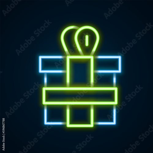 Glowing neon line Gift box icon isolated on black background. Colorful outline concept. Vector