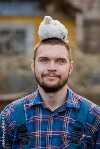 Photography Funny, smiling farmer with a beard a Caucasian-looking man in a shirt with a whi