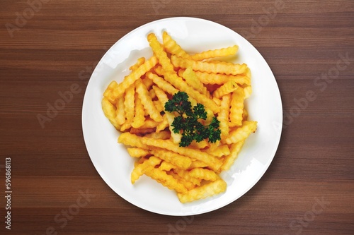 Roasted tasty fry potatoes on desk