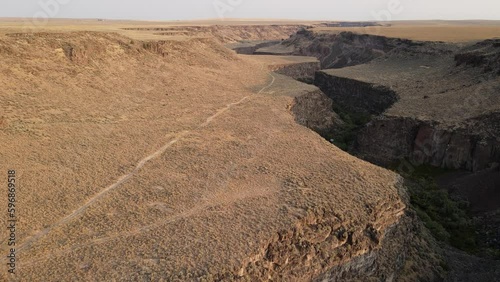 Flying down a river canyon in Southern Idaho photo