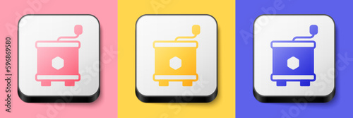 Isometric Honey extractor icon isolated on pink, yellow and blue background. Mechanical device for honey extraction from honeycombs. Square button. Vector