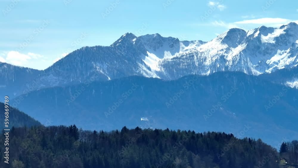 Amazing snow capped mountains near Lake Woerthersee in Austria - travel photography Amazing snow capped mountains near Lake Woerthersee in Austria - travel photography