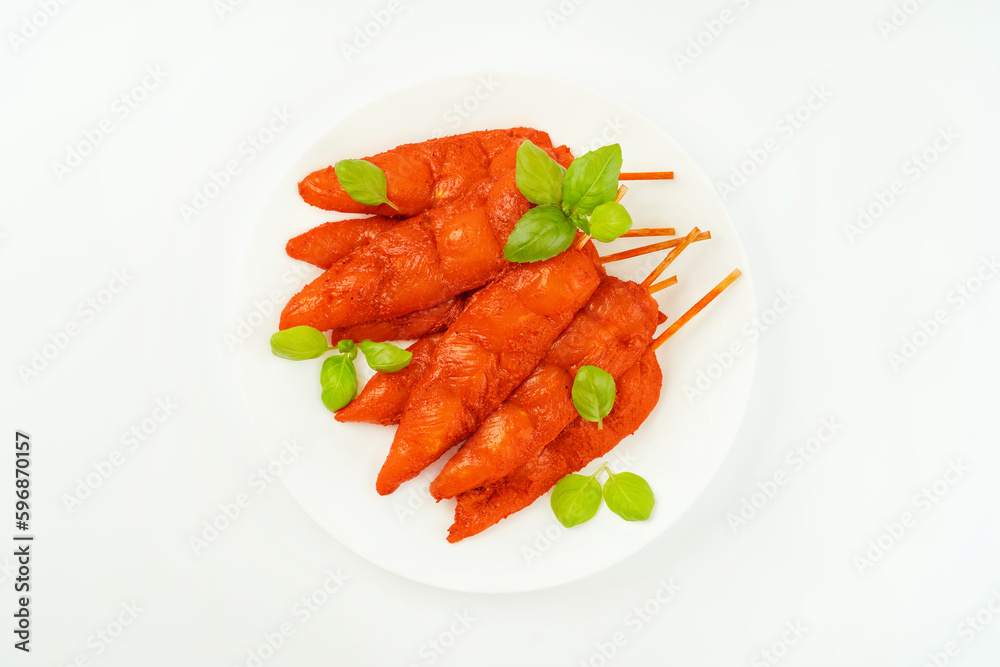 Fresh raw marinated chicken meat skewers iner fillet on a white background.Top view.Copy space.Closeup of chicken meat.Chicken breast inner Fillets.Marinated Chicken skewers fillet meat. Fresh raw marinated chicken meat skewers iner fillet on a white background.Top view.Copy space.Closeup of chicken meat.Chicken breast inner Fillets.Marinated Chicken skewers fillet meat.