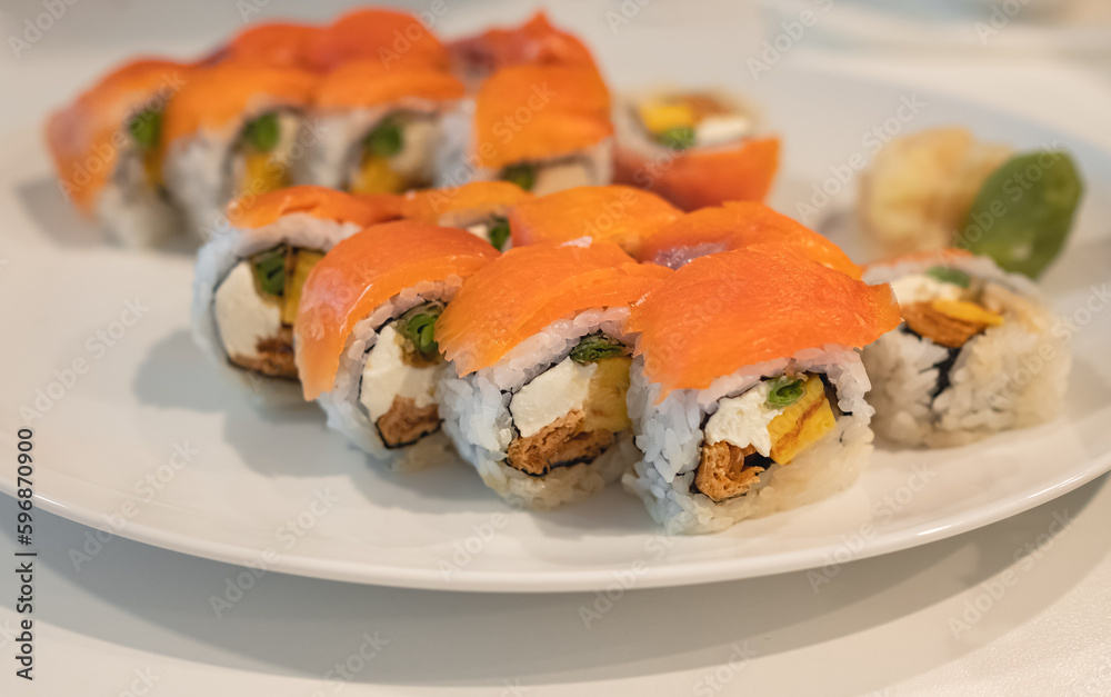 Japanese sushi food. Philadelphia roll sushi with salmon, avocado, cream cheese. Sushi menu. View of assorted sushi