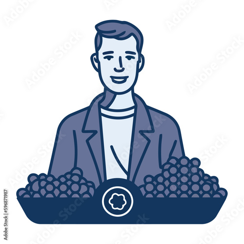 Handsome businessman holding grapes, a symbol of success