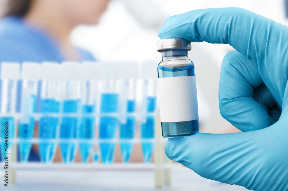Bottle of Vaccine in doctor hands in hospital