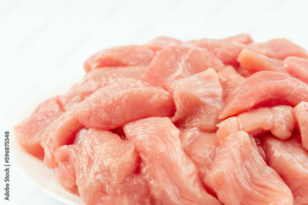 Fresh frozen pieces of turkey meat on a white background.Raw chicken.Frozen chicken fillet..Ogranic food and healthy eating.frozen turkey or poultry meat. Fresh frozen pieces of turkey meat on a white background.Raw chicken.Frozen chicken fillet..Ogranic food and healthy eating.frozen turkey or poultry meat.