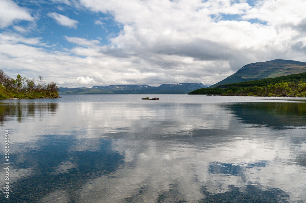 Lake water surface and cloud reflection in Abisko National Park, Sweden