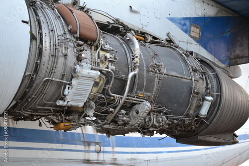 Large aircraft engine in the hangar. Broken aircraft engine. 