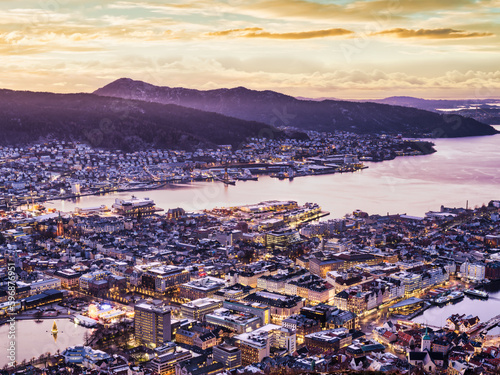 Buikdings and streets are lit up after sunset in Sentrum, Bergen, Norway photo
