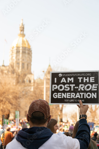 Man holding sign at pro-life rally