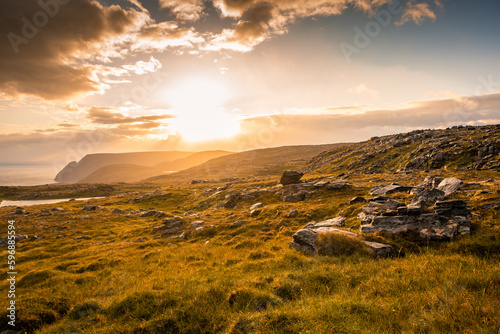 Bilde på lerret Midnight sun rising over Knivskjellodden, a trail in the tundra towards the true