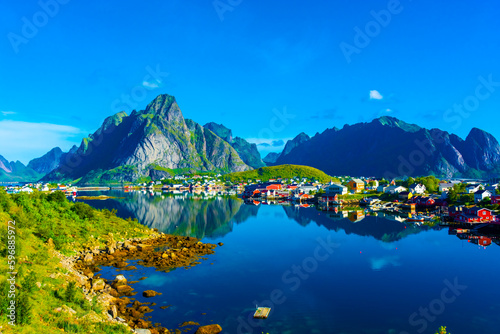 Fototapeta Naklejka Na Ścianę i Meble -  Perfect reflection of the Reine village on the water of the fjord in the Lofoten Islands,  Norway