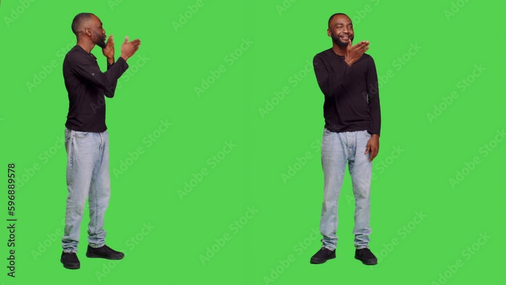 African american man sending air kisses on camera, posing with kissy face on full body greenscreen. Young adult being romantic in studio and doing flirty gesture, optimistic reaction. African american man sending air kisses on camera, posing with kissy face on full body greenscreen. Young adult being romantic in studio and doing flirty gesture, optimistic reaction.