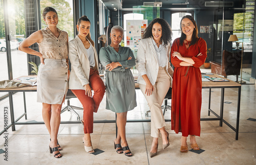 Designers who can do it all. Shot of a group of female designers standing in an office.