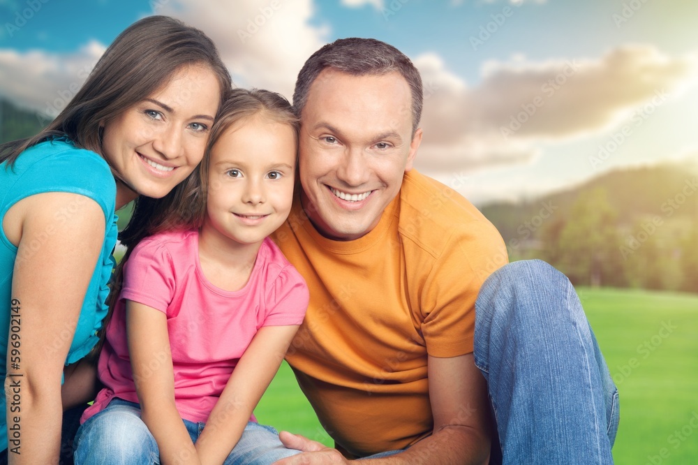 Happy young parents with cute child walking outdoors Happy young parents with cute child walking outdoors