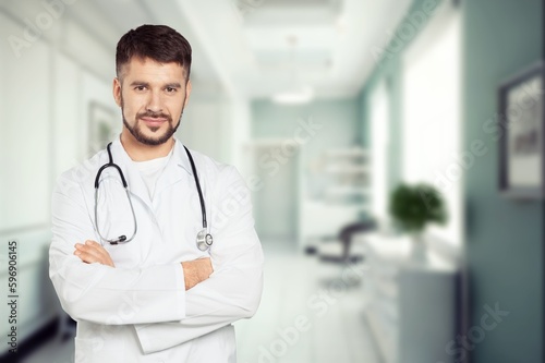 Portrait of happy doctor standing at hospital