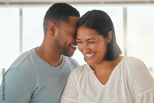 I love being around you. Shot of an affectionate couple standing together in their home.