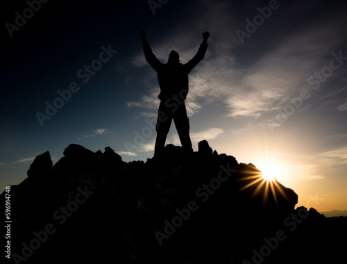Man reaching the top of success in the mountain