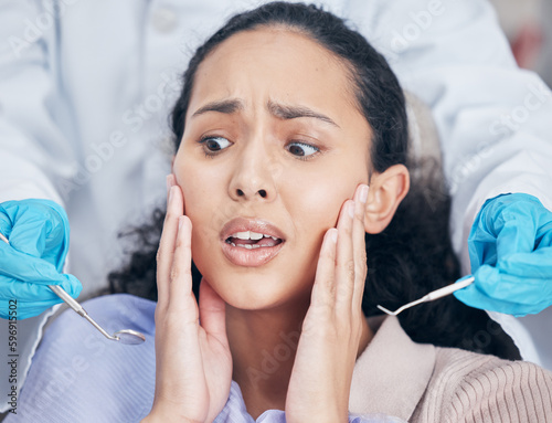 So many sharp objects. Shot of a young woman looking afraid at her dentists office.