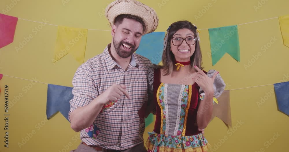 Brazilian couple, dressed in Junina party clothes, São João party. Protocol scenes.