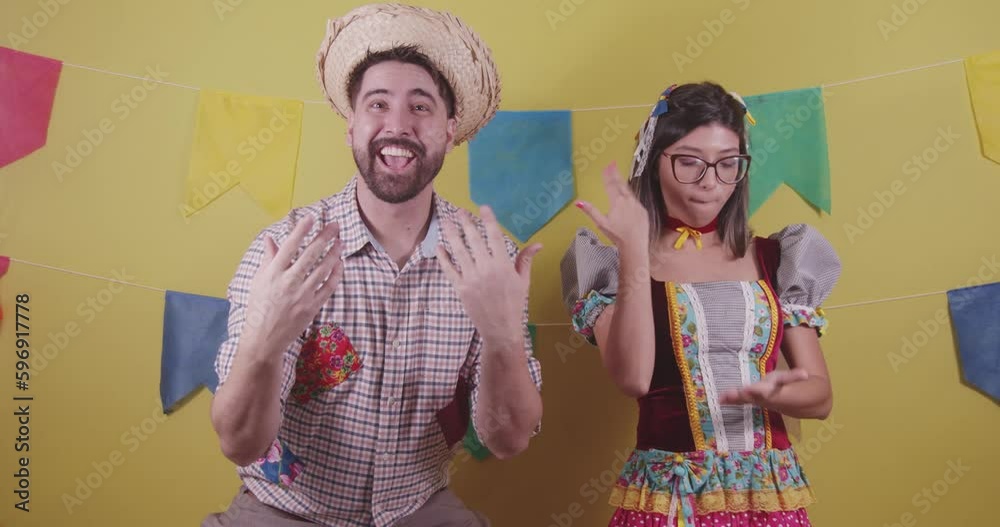 Brazilian couple, dressed in Junina party clothes, São João party. Protocol scenes.