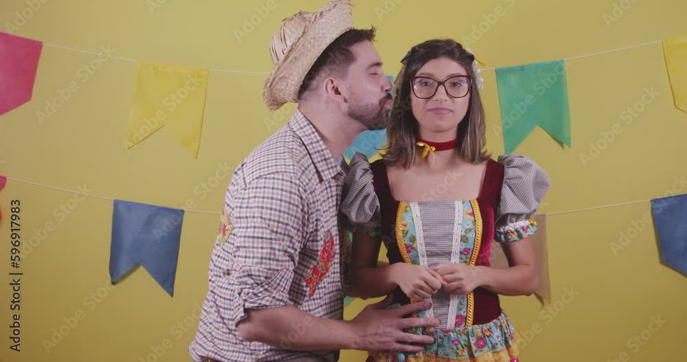Brazilian couple, dressed in Junina party clothes, São João party. Protocol scenes.