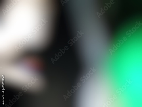 Abstract blur background image of black, green colors gradient used as an illustration. Designing posters or advertisements.
