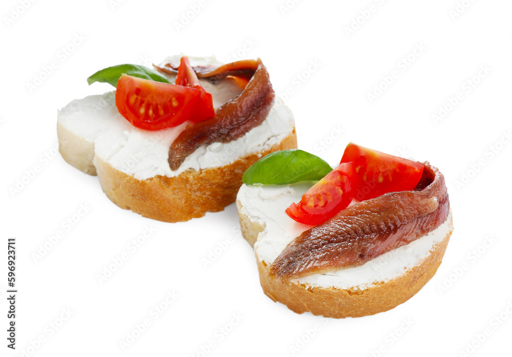Delicious sandwiches with cream cheese, anchovies, tomatoes and basil on white background Delicious sandwiches with cream cheese, anchovies, tomatoes and basil on white background