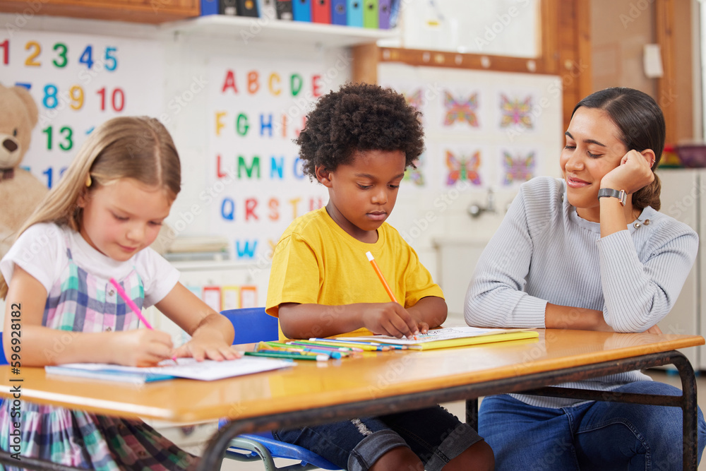 I just love watching their little achievements. Shot of a young woman teaching a class of preschool children. I just love watching their little achievements. Shot of a young woman teaching a class of preschool children.