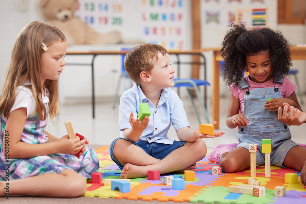 Fototapeta premium Giving children the freedom to play helps them learn. Shot of a group of preschool students playing together.