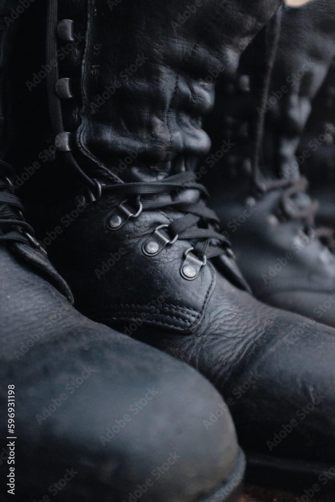 closeup of a black military leather combat boots