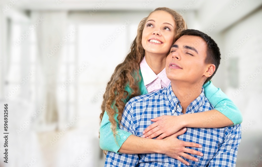 A happy young couple have fun in the living room. A happy young couple have fun in the living room.