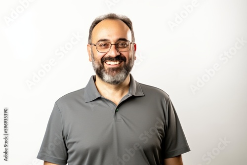 portrait of a happy middle-aged man on a white background © Anne-Marie Albrecht