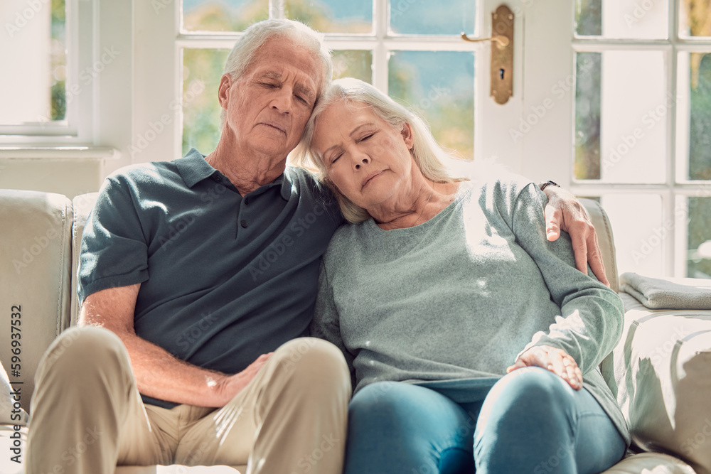 No better place to be. Cropped shot of an affectionate senior couple sitting in their living room at home. No better place to be. Cropped shot of an affectionate senior couple sitting in their living room at home.