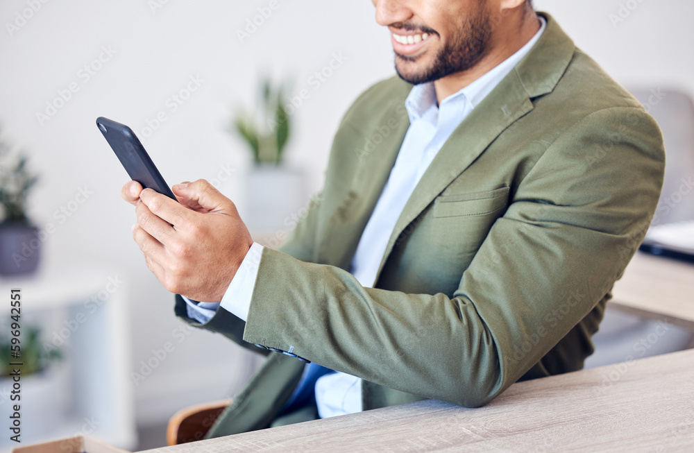 Connections are a businessmans best friend. Cropped shot of an unrecognizable young businessman working at his desk in the office. Connections are a businessmans best friend. Cropped shot of an unrecognizable young businessman working at his desk in the office.