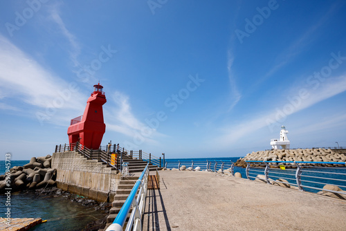 Wonderful Iho Tewoo Beach two horse shaped lighthouses. Jeju Island, South Korea