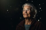 Portrait of senior woman with eyeglasses looking away at night