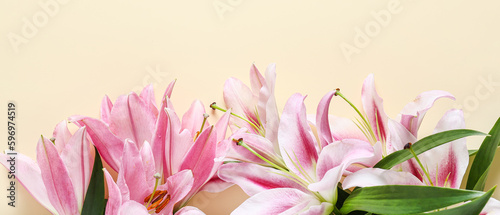 Beautiful lilies on beige background  top view