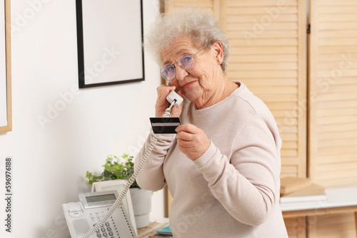 Senior woman with credit ca...