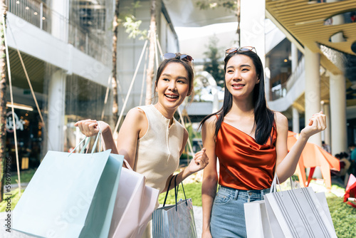 Картината върху платно Asian young two woman shopping goods outdoors in department store