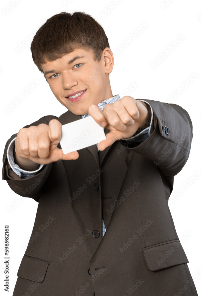Teen male in suit holding out business card Teen male in suit holding out business card