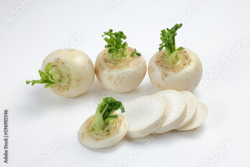 Small white round snowball radish on white background sliced diced stacked