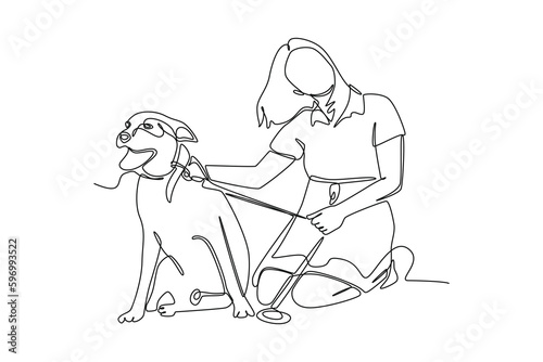 Continuous one line drawing dog with its owner. Urban pets concept. Single line draw design vector graphic illustration.