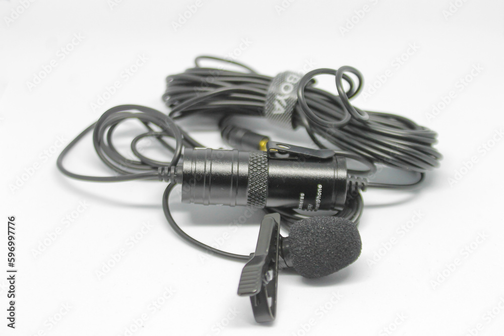 Surabaya, Indonesia - April 2023 : wired microphone isolated object black color on white background Surabaya, Indonesia - April 2023 : wired microphone isolated object black color on white background