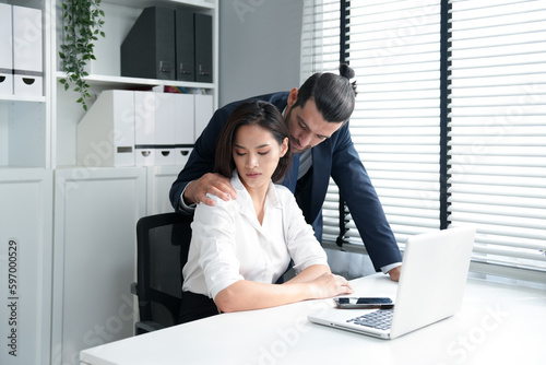Εκτύπωση καμβά Asian pretty businesswoman sitting and looking at boss flirting by hand touch a
