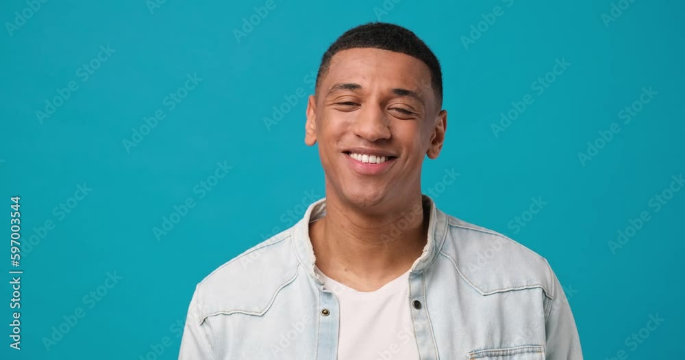 Young african american man satisfied happy guy standing over blue background